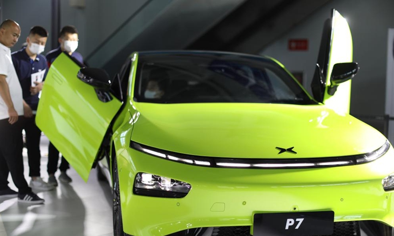 Visitors view a new energy vehicle during the Shenyang (China) International Automobile Industry Expo 2022 in Shenyang, northeast China's Liaoning Province, June 26, 2022.Photo:Xinhua