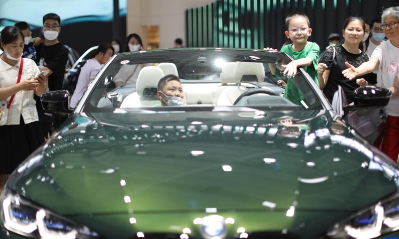 Visitors view a new energy vehicle during the Shenyang (China) International Automobile Industry Expo 2022 in Shenyang, northeast China's Liaoning Province, June 26, 2022.Photo:Xinhua