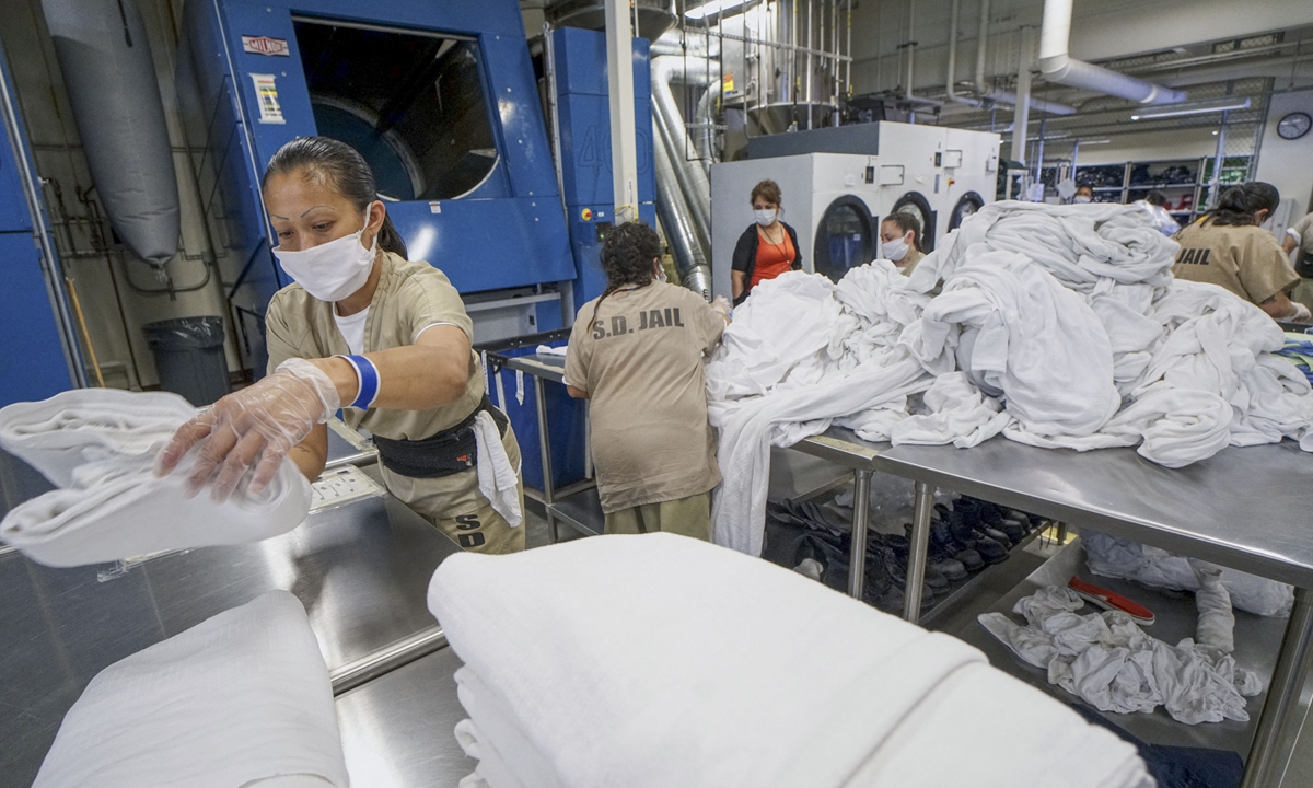 Inmates work in the laundry room at Las Colinas Women's Detention Facility in California on April 22, 2020. Photo: AFP