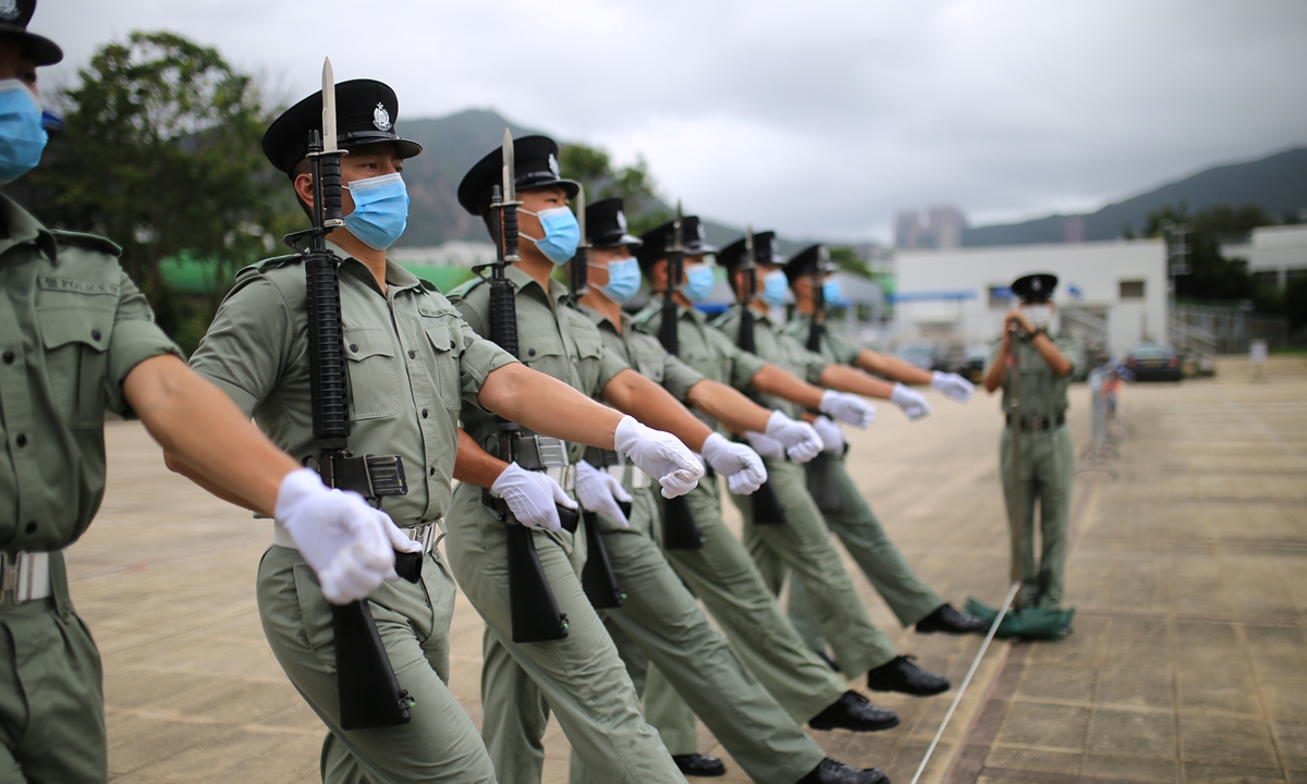 Police officers of the HKSAR practice Chinese-style foot drills. Photo: Fan Lingzhi/GT