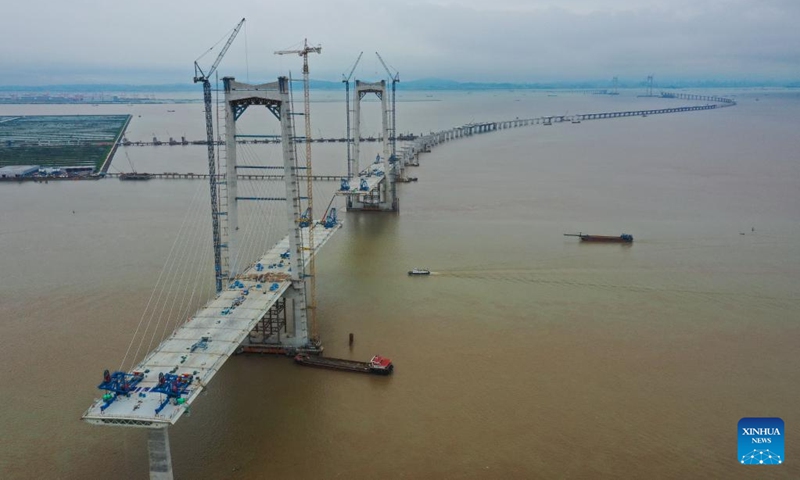 Aerial photo taken on May 15, 2022 shows the Shenzhen-Zhongshan highway link under construction in south China's Guangdong Province. The total length of Shenzhen-Zhongshan highway link will be 24 kilometers and include an underwater tunnel and two artificial islands. The link will open to traffic in 2024. With the building of traffic arteries, the connectivity in the Guangdong-Hong Kong-Macao Greater Bay Area has been continuously improved.(Photo: Xinhua)