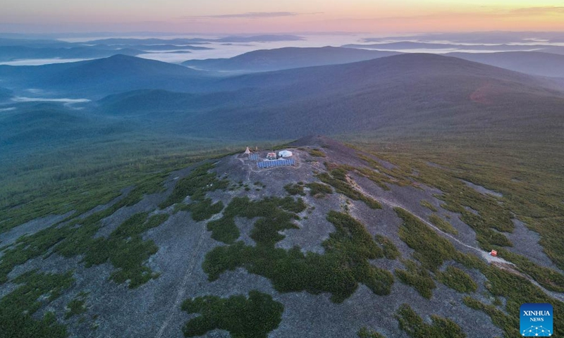 Aerial photo taken on June 29, 2022 shows the sunrise at Okliet Mountain in Genhe City, north China's Inner Mongolia Autonomous Region.(Photo: Xinhua)