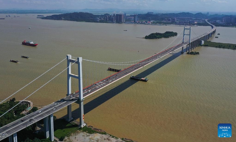 Aerial photo taken on June 23, 2020 shows a view of the Humen Bridge, which links Guangzhou City and Dongguan City, in south China's Guangdong Province. With the building of traffic arteries, the connectivity in the Guangdong-Hong Kong-Macao Greater Bay Area has been continuously improved. The convenient transport network has also enhanced the logistics efficiency within the area and injected new vitality into local development of business.(Photo: Xinhua)