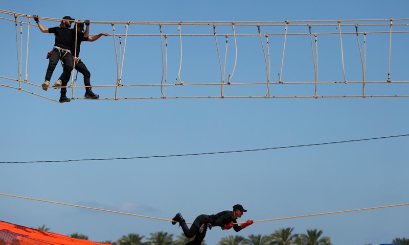 Members of the Palestinian Hamas security forces show their skills as they take part in a military graduation ceremony in the southern Gaza Strip city of Khan Younis, on June 30, 2022.(Photo: Xinhua)