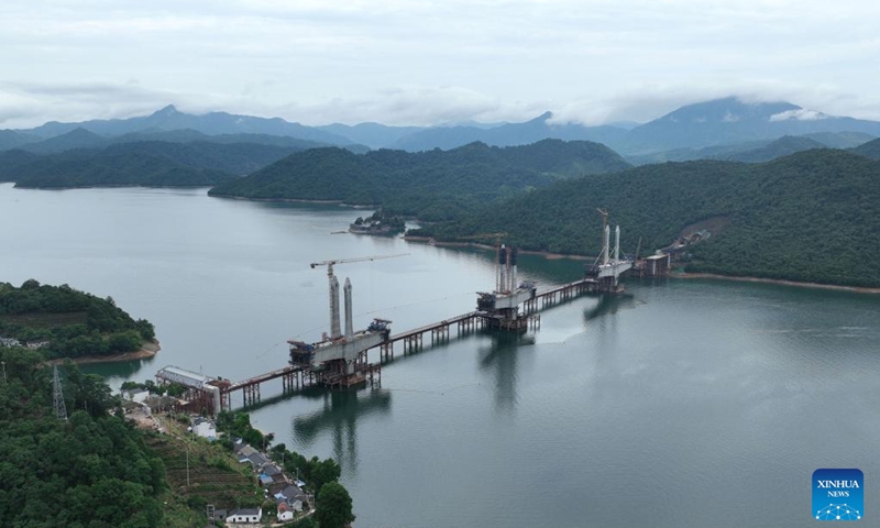 Aerial photo taken on June 29, 2022 shows the main towers of Taiping Lake grand bridge in Huangshan, east China's Anhui Province. The third main tower of Taiping Lake grand bridge was capped on Wednesday, marking the completion of all three main towers of the bridge. Taiping Lake grand bridge is a control project of Chizhou-Huangshan Railway with a total length of 926.1 meters.(Photo: Xinhua)