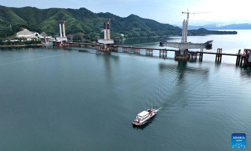 Aerial photo taken on June 29, 2022 shows the main towers of Taiping Lake grand bridge in Huangshan, east China's Anhui Province. The third main tower of Taiping Lake grand bridge was capped on Wednesday, marking the completion of all three main towers of the bridge. Taiping Lake grand bridge is a control project of Chizhou-Huangshan Railway with a total length of 926.1 meters.(Photo: Xinhua)