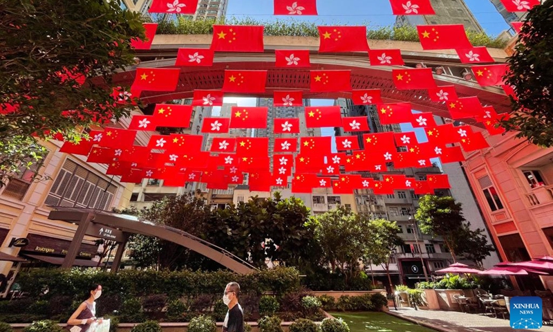 China's national flags and the Hong Kong Special Administrative Region (HKSAR) flags fly along the Lee Tung Avenue in Hong Kong, south China, June 28, 2022. July 1 this year marks the 25th anniversary of Hong Kong's return to the motherland.(Photo: Xinhua)
