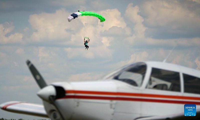 A parachutist is seen at the Fly in Limbazi air show in Limbazi, Latvia, on July 2, 2022.Photo:Xinhua