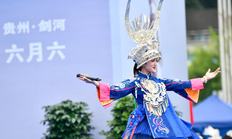 A woman performs folk dance during activities to celebrate Liuyueliu, an ethnic festival, in Jianhe County of Qiandongnan Miao and Dong Autonomous Prefecture, southwest China's Guizhou Province, July 2, 2022.Photo:Xinhua