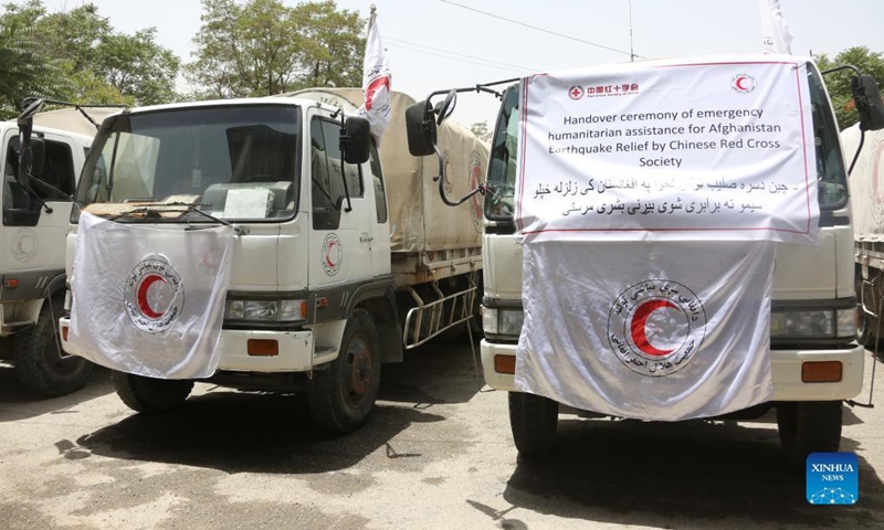 Photo taken on July 3, 2022 shows trucks carrying earthquake relief supplies donated by the Red Cross Society of China (RCSC) at a handover ceremony in Kabul, Afghanistan. The Afghan Red Crescent Society (ARCS) has received earthquake relief supplies donated by the RCSC.(Photo: Xinhua)