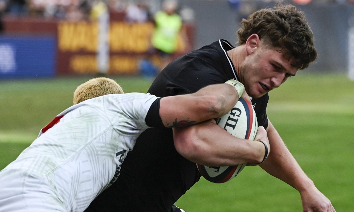 Dalton Papalii of the All Blacks is tackled during the 1874 rugby cup between the USA Eagles and New Zealand All Blacks in Landover, the US on October 23, 2021. Photo: AFP