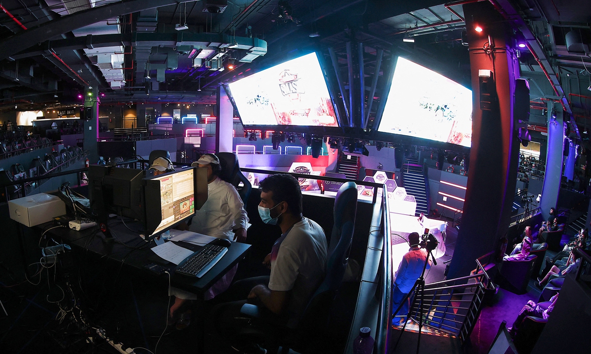 Esport athletes compete during Virtuocity Smash Open 2022 at the Doha Festival City on March 17, 2022. Photo: AFP