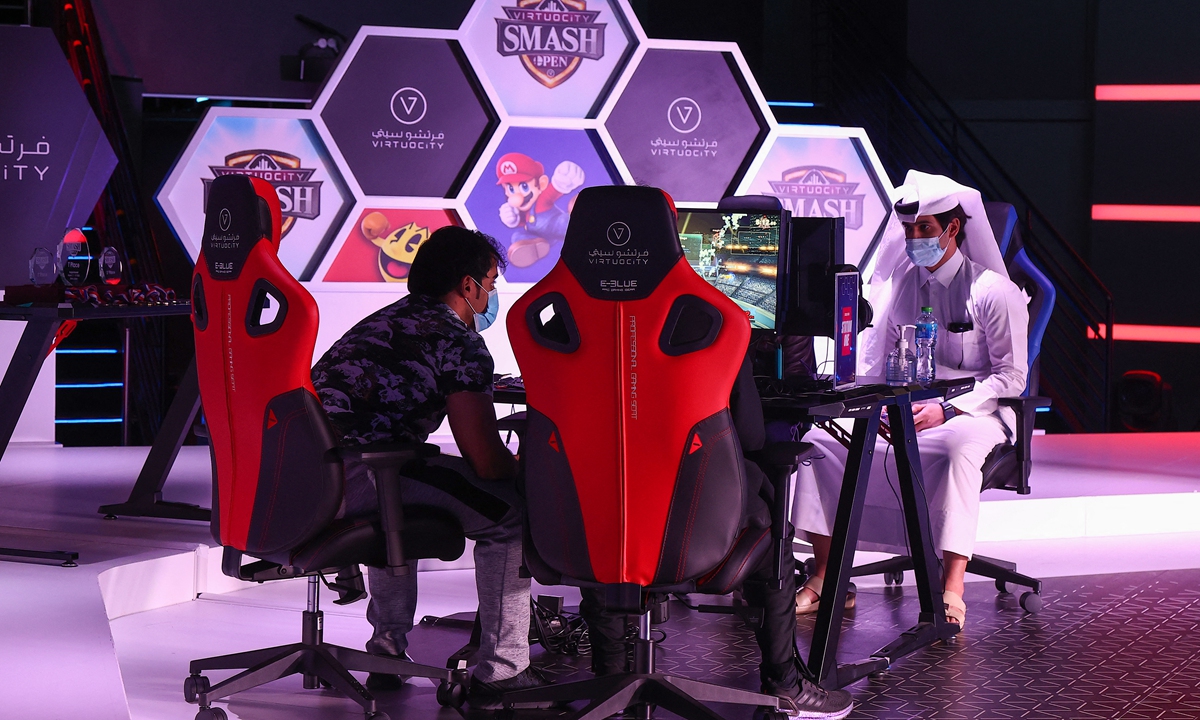 Esport athletes compete during Virtuocity Smash Open 2022 at the Doha Festival City on March 17, 2022. Photo: AFP