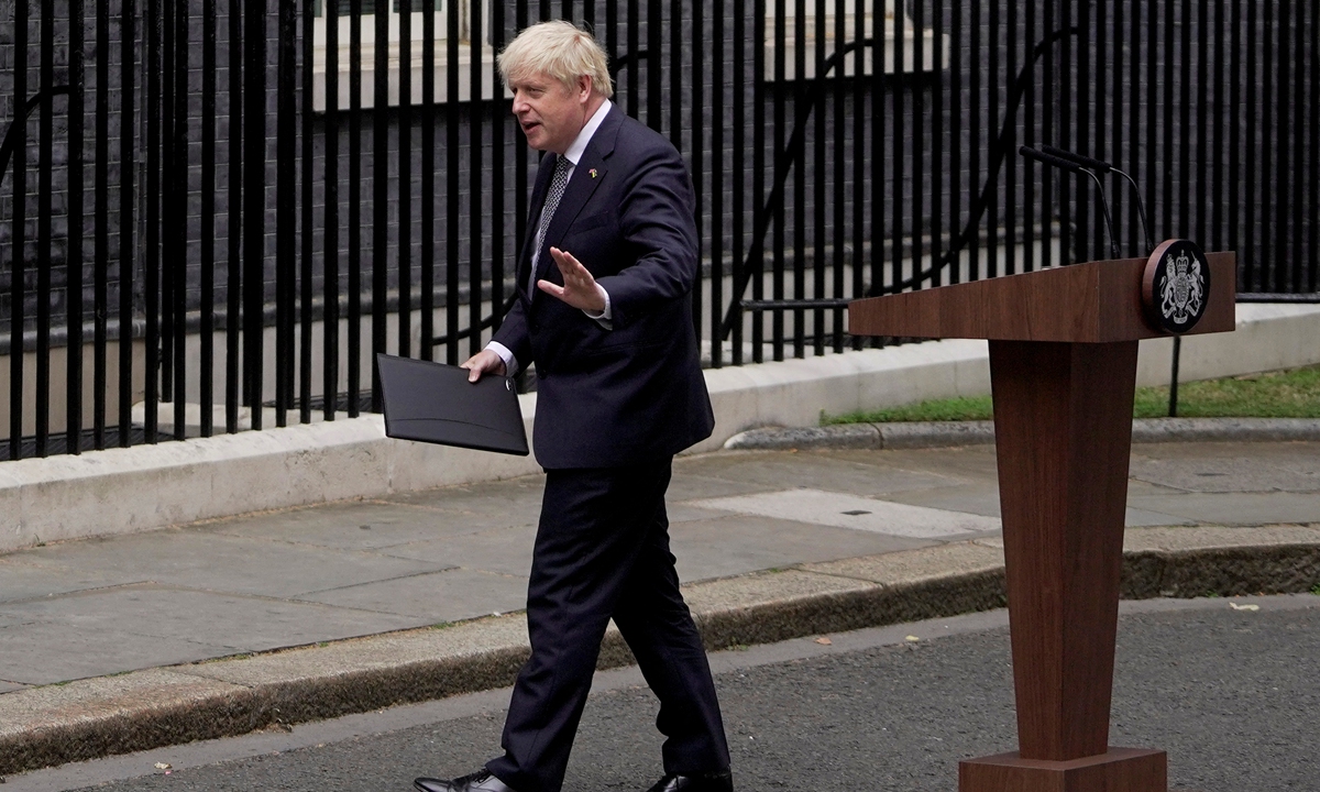 British Prime Minister Boris Johnson leaves after making a resignation statement in front of 10 Downing Street in London on July 7, 2022. Johnson quit as Conservative party leader, after three tumultuous years in charge marked by Brexit, COVID pandemic and mounting scandals. Photo: AFP