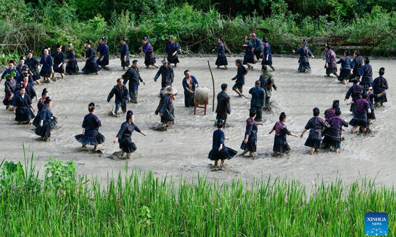 Villagers perform Shuigu (water drum) dance in Jianhe County of Qiandongnan Miao and Dong Autonomous Prefecture, southwest China's Guizhou Province, July 8, 2022.Photo:Xinhua