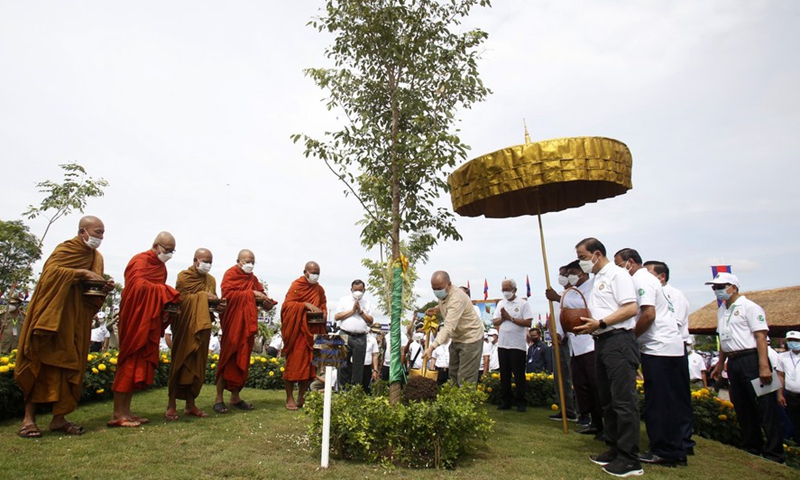 Cambodian King Norodom Sihamoni plants a tree seedling in Battambang province, Cambodia, July 9, 2022.Photo:Xinhua