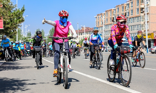 Cyclists riding in Huhhot, North China's Inner Mongolia Autonomous Region. Photo: VCG