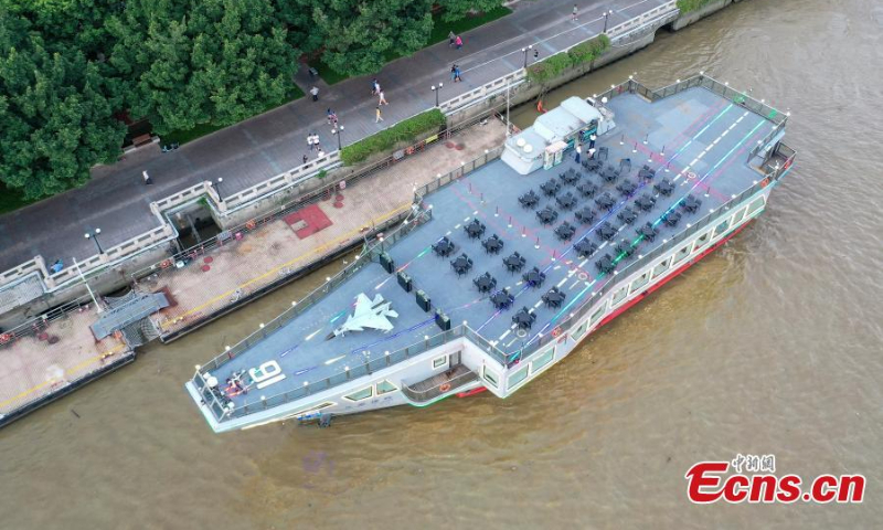 The aircraft carrier themed cruise ship, Blue Dolphin 16, sails on the Pearl River in Guangzhou, south China's Guangdong Province, July 12, 2022. (Photo: China News Service/Chen Jimin)