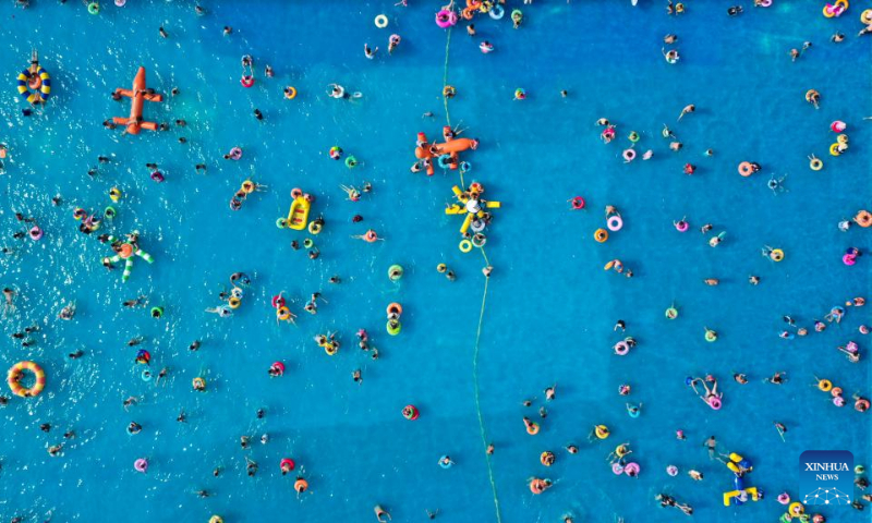 Aerial photo taken on July 16, 2022 shows people playing at a water park in Zunhua City, north China's Hebei Province. (Xinhua/Liu Mancang)