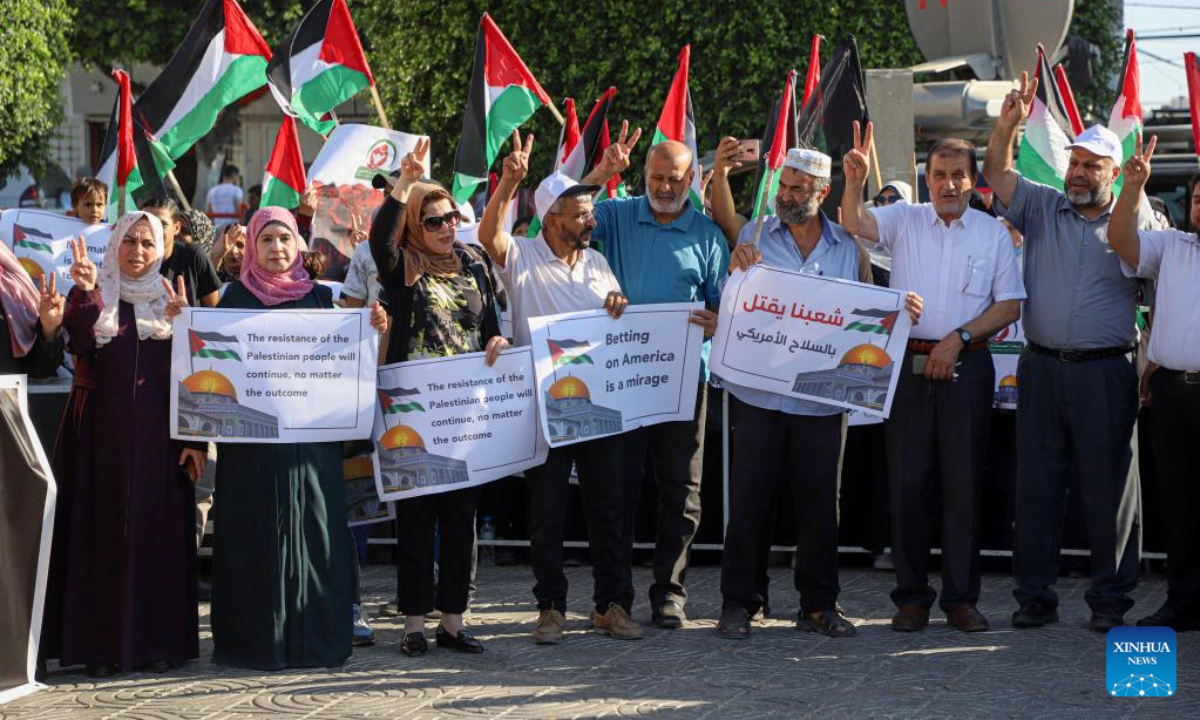 Palestinians protest against US President Joe Biden's visit, in Gaza City, on July 14, 2022. Thousands of Palestinians on Thursday staged demonstrations in the West Bank and Gaza Strip against US President Joe Biden's first visit to Israel and the Palestinian territories, slamming his biased stance on the Israeli-Palestinian issue. Photo:Xinhua