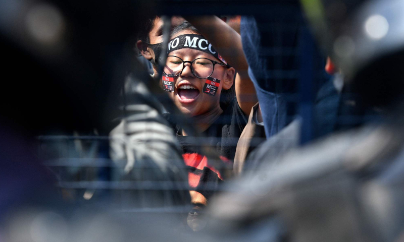 A demonstrator gestures and chants slogans during a protest against the proposed grant agreement from the US under the Millennium Challenge Corporation (MCC), in Kathmandu on February 20, 2022. Photo: VCG