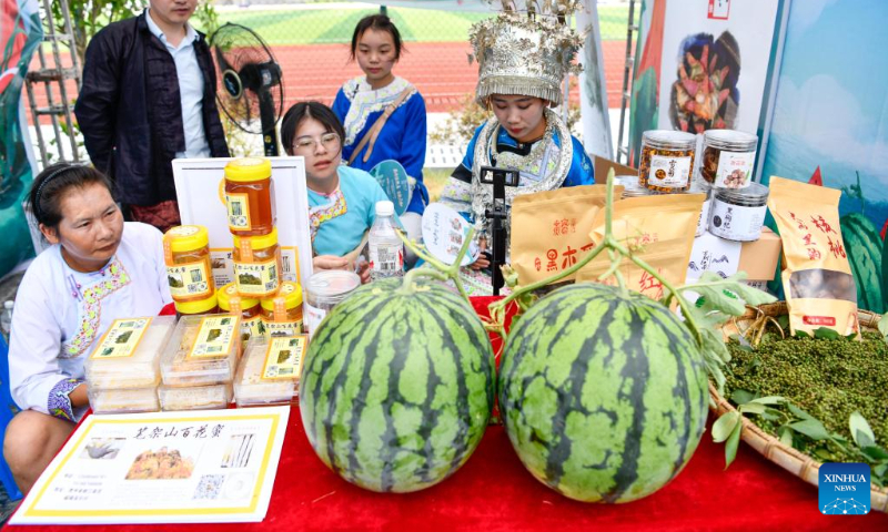 Watermelons and other agricultural products are seen during a watermelon festival held in Rongjiang County, southwest China's Guizhou Province, July 15, 2022. (Xinhua/Yang Wenbin)