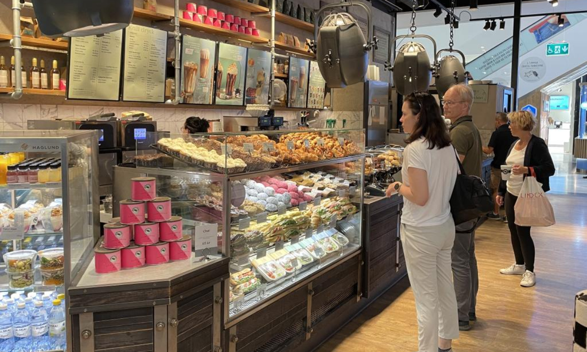 Customers are seen at a coffee shop in Stockholm, Sweden, on July 14, 2022. Photo:Xinhua