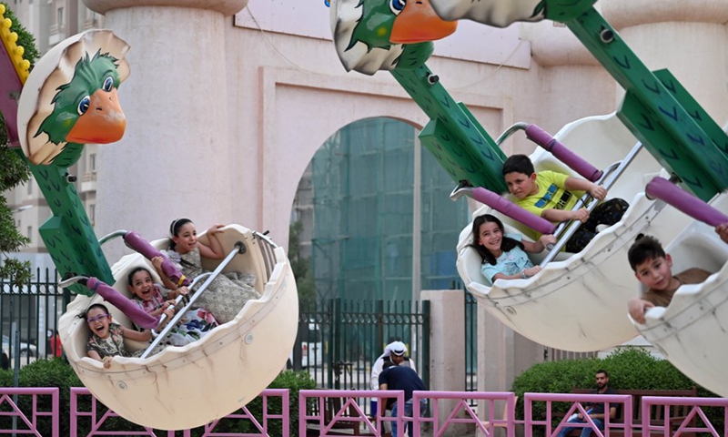 Children spend time at an amusement park during the Eid al-Adha holiday in Hawally Governorate, Kuwait, on July 10, 2022.(Photo: Xinhua)