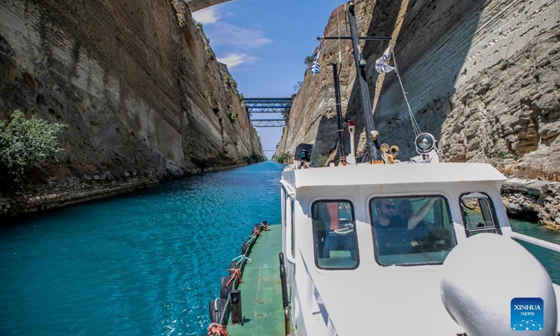 A boat sails in the Corinth Canal in Greece, on July 11, 2022. Greece's iconic Corinth Canal reopened to shipping earlier this month after an 18-month hiatus for repair works following a series of landslides, local officials told Xinhua on Monday.(Photo: Xinhua)