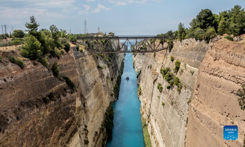 A boat sails in the Corinth Canal in Greece, on July 11, 2022. Greece's iconic Corinth Canal reopened to shipping earlier this month after an 18-month hiatus for repair works following a series of landslides, local officials told Xinhua on Monday.(Photo: Xinhua)