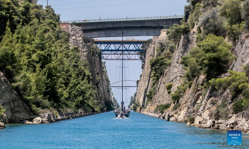A boat sails in the Corinth Canal in Greece, on July 11, 2022. Greece's iconic Corinth Canal reopened to shipping earlier this month after an 18-month hiatus for repair works following a series of landslides, local officials told Xinhua on Monday.(Photo: Xinhua)