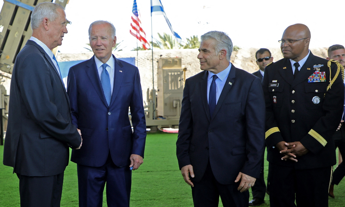 (L toR) Israel's Defense Minister Benny Gantz, US President Joe Biden, Israeli caretaker Prime Minister Yair Lapid and US Defense Attache in Israel, Brigadier General Shawn A. Harris, stand in front of Israel's Iron Dome defense system during a tour at Ben Gurion Airport near Tel Aviv, on July 13, 2022.Photo: AFP