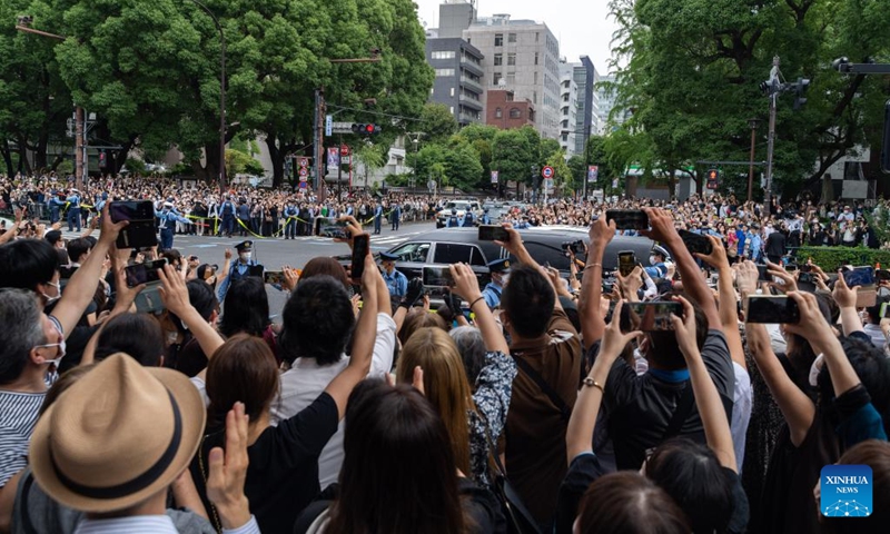 The hearse carrying the body of Japan's former Prime Minister Shinzo Abe runs on a street in Tokyo, Japan, July 12, 2022. A funeral was held on Tuesday in central Tokyo for Abe, who was shot dead while delivering a speech last week.(Photo: Xinhua)