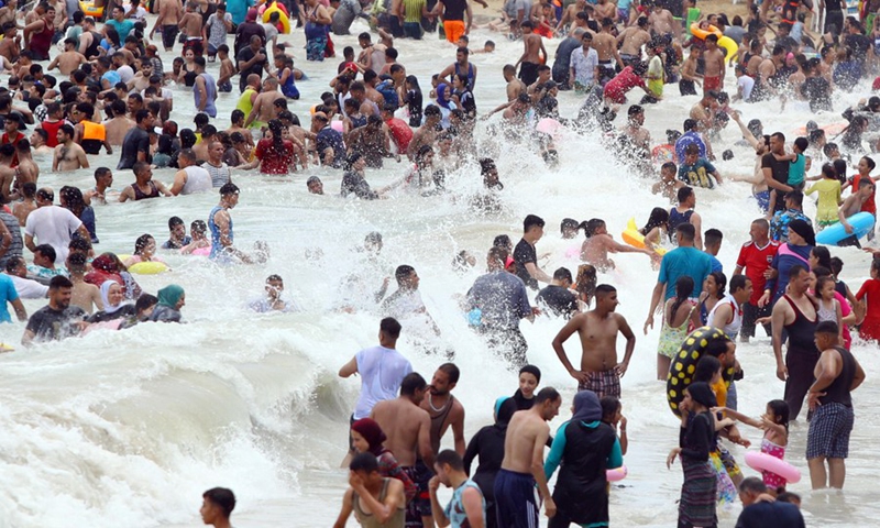 People spend time at the seaside during the Eid al-Adha holiday in Alexandria, Egypt, on July 11, 2022.(Photo: Xinhua)
