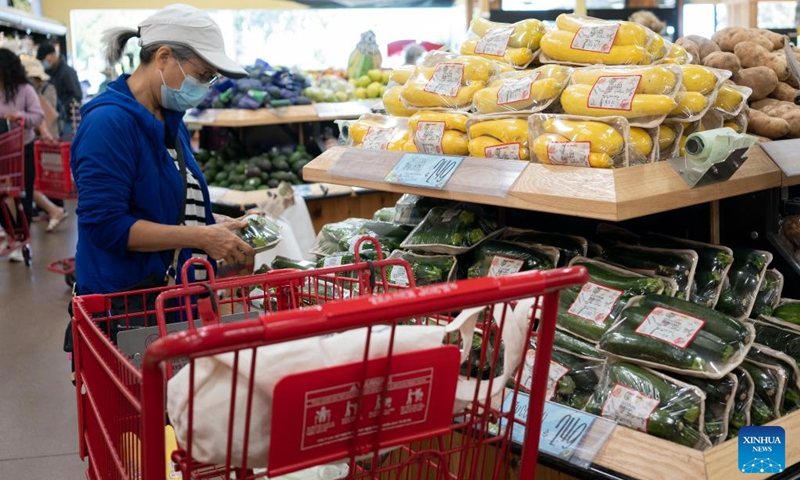 A customer selects goods at a supermarket in Millbrae, California, the United States, July 13, 2022. U.S. consumer price index (CPI), a broad measure of everyday goods and services, soared 9.1 percent in June from a year ago, marking the largest 12-month increase since the period ending November 1981, the Labor Department reported Wednesday.(Photo: Xinhua)
