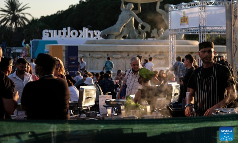 People take part in the Malta International Food Festival in Valletta, Malta, on July 13, 2022.(Photo: Xinhua)