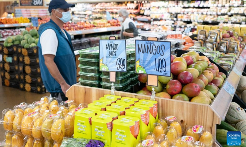 A customer selects goods at a supermarket in Millbrae, California, the United States, July 13, 2022. U.S. consumer price index (CPI), a broad measure of everyday goods and services, soared 9.1 percent in June from a year ago, marking the largest 12-month increase since the period ending November 1981, the Labor Department reported Wednesday.(Photo: Xinhua)