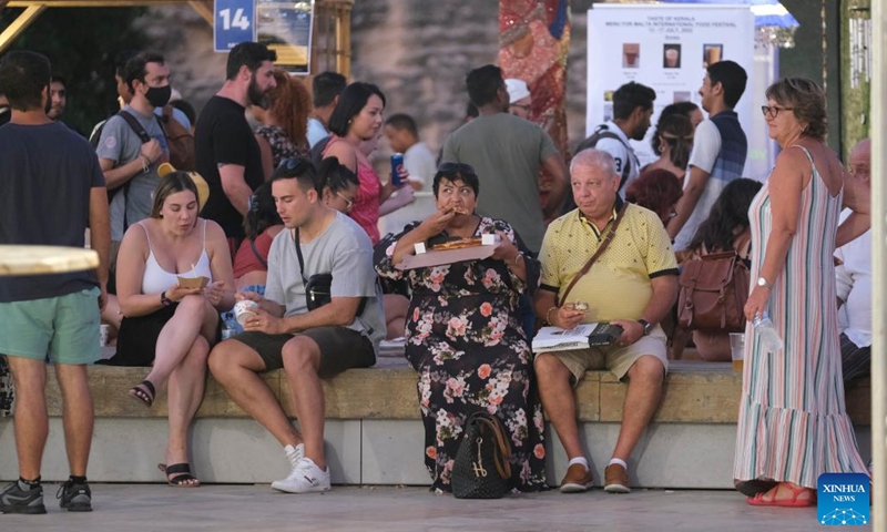 People enjoy food at the Malta International Food Festival in Valletta, Malta, on July 13, 2022.(Photo: Xinhua)