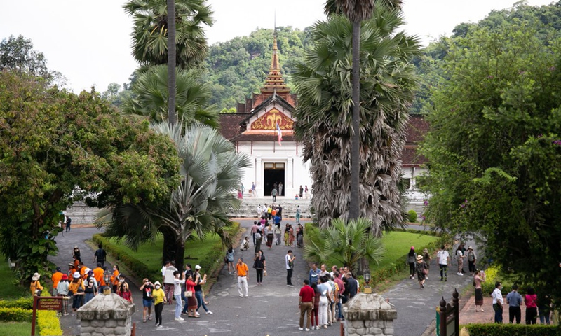 Tourists visit the town of Luang Prabang, a UNESCO world heritage site in Laos, July 15, 2022.(Photo: Xinhua)