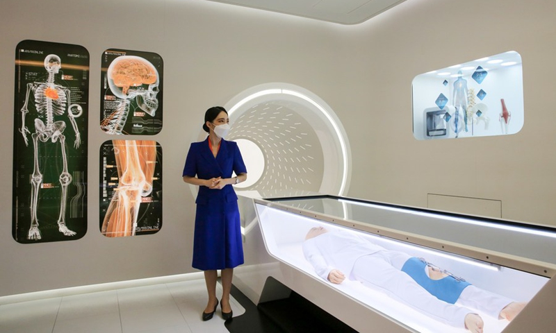 A guide explains an artificial intelligence doctor at the medical room aboard the space shuttle at T.um exhibition hall in Seoul, South Korea, July 19, 2022.(Photo: Xinhua)