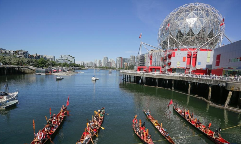 Indigenous canoes are seen in front of Science World during a canoe arrival ceremony in Vancouver, British Columbia, Canada, on July 14, 2022. Indigenous people participated in the canoe arrival ceremony on Thursday to mark the opening of the Sacred Journey exhibition at Science World in Vancouver. The Sacred Journey is an exhibition showcasing Northwest Coast canoe cultures and the indigenous people's way of life.(Photo: Xinhua)
