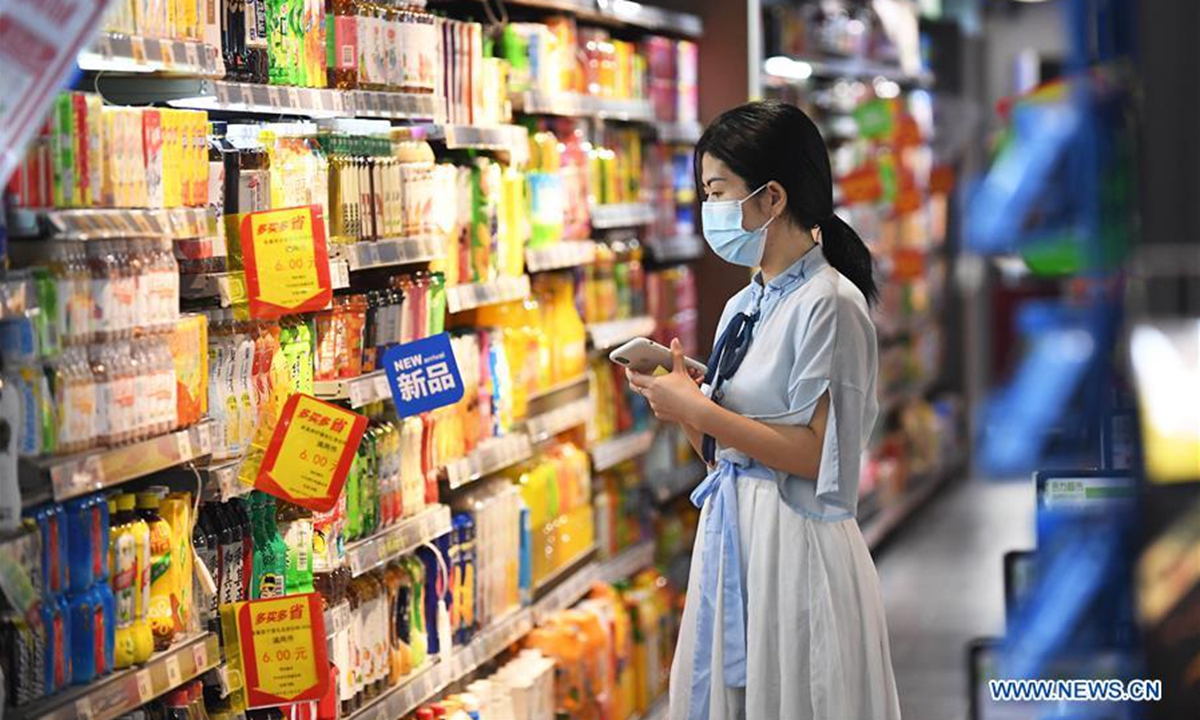 A customer selects drinks at a supermarket in Guiyang, southwest China's Guizhou Province. Photo: Xinhua