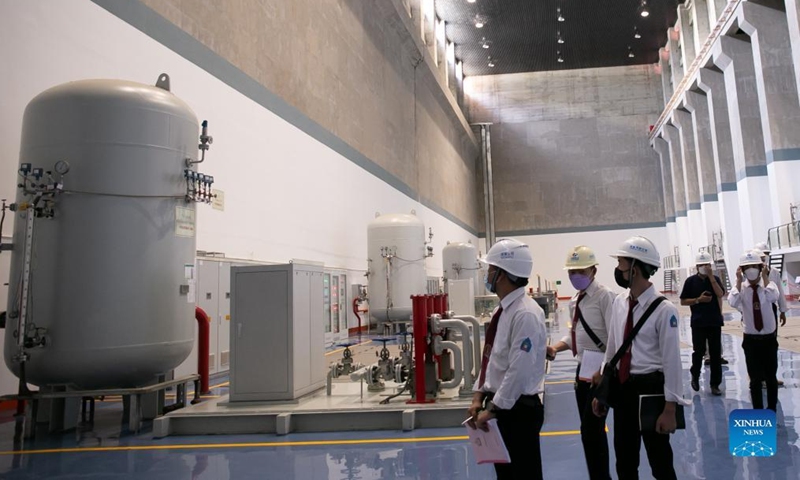 College students and journalists visit the Nam Ou 1 hydropower plant of the Nam Ou River Cascade Hydropower Project in Luang Prabang, Laos, July 13, 2022.Photo:Xinhua