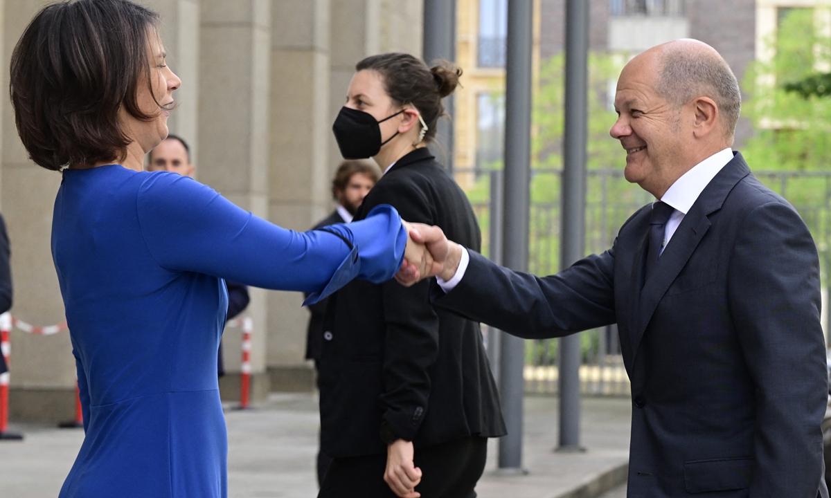 German Foreign Minister Annalena Baerbock (left) greets German Chancellor Olaf Scholz as he arrives to attend the 13th Petersberg Climate Dialogue on July 18, 2022 at the Foreign Ministry in Berlin. The Petersberg Climate Dialogue is a series of annual conferences set to prepare the UN Climate Change Conferences and the COP (Conference of the Parties) conferences.
Photo: AFP