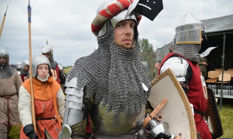 Enthusiasts dressed as knights are seen in action during a reenactment of the Battle of Grunwald, in Grunwald, Poland, on July 16, 2022.Photo:Xinhua