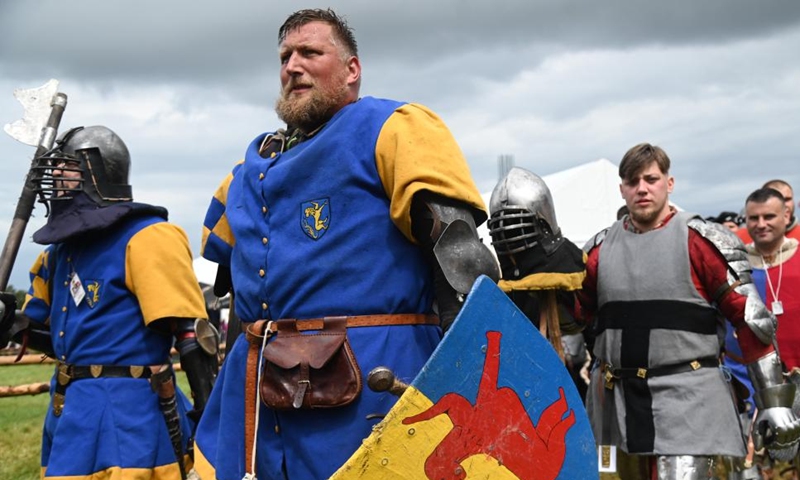 Enthusiasts dressed as knights are seen in action during a reenactment of the Battle of Grunwald, in Grunwald, Poland, on July 16, 2022.Photo:Xinhua