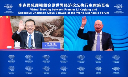 Chinese Premier Li Keqiang meets with Klaus Schwab, executive chairman of the World Economic Forum (WEF), via video link at the Great Hall of the People in Beijing, capital of China, July 19, 2022. (Xinhua/Zhai Jianlan)