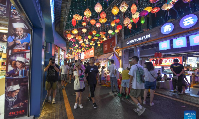 People tour a local market at the Qingyun Road in Nanming District of Guiyang, capital city of southwest China's Guizhou Province, July 21, 2022. Photo: Xinhua