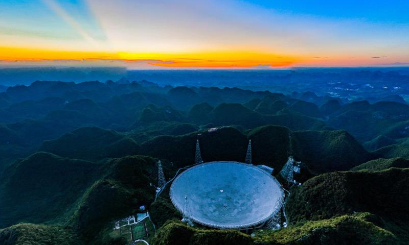 Aerial photo taken on July 21, 2022 shows China's Five-hundred-meter Aperture Spherical Radio Telescope (FAST) under maintenance in southwest China's Guizhou Province. Using FAST, also dubbed as the China Sky Eye, scientists have identified over 660 new pulsars since October 2017. Photo: Xinhua