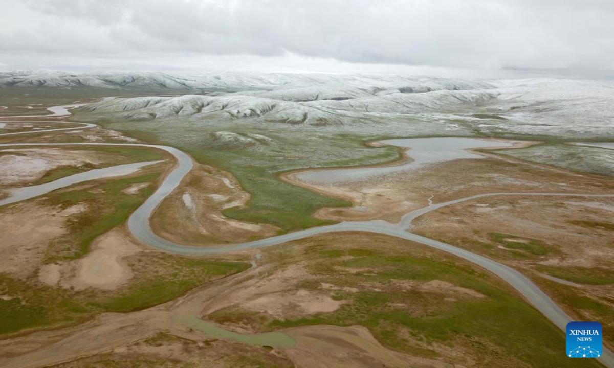 Aerial photo taken on July 21, 2022 shows a view of Mount Anyemaqen of Golog Tibetan Autonomous Prefecture, northwest China's Qinghai Province. Affected by cold air, Golog saw snowfall recently during the summer days. Photo:Xinhua